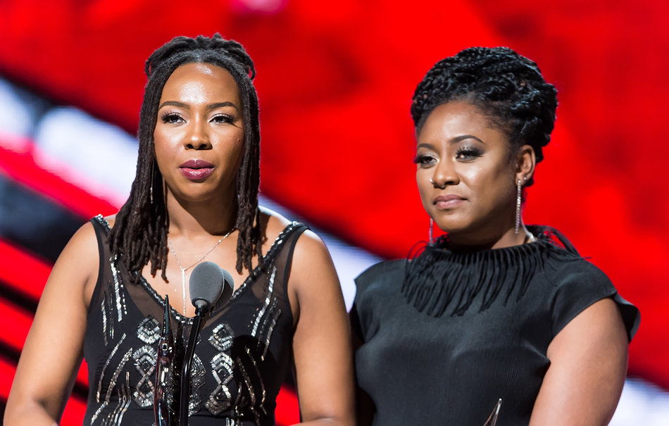 NEWARK, NEW JERSEY - APRIL 01: Black Lives Matter founders and Change Agent Award recipient's Opall Tometi and Alicia Garza speak onstage during BET Black Girls Rock! 2016 at New Jersey Performing Arts Center on April 1, 2016 in Newark, New Jersey. (Photo by Gilbert Carrasquillo/FilmMagic)